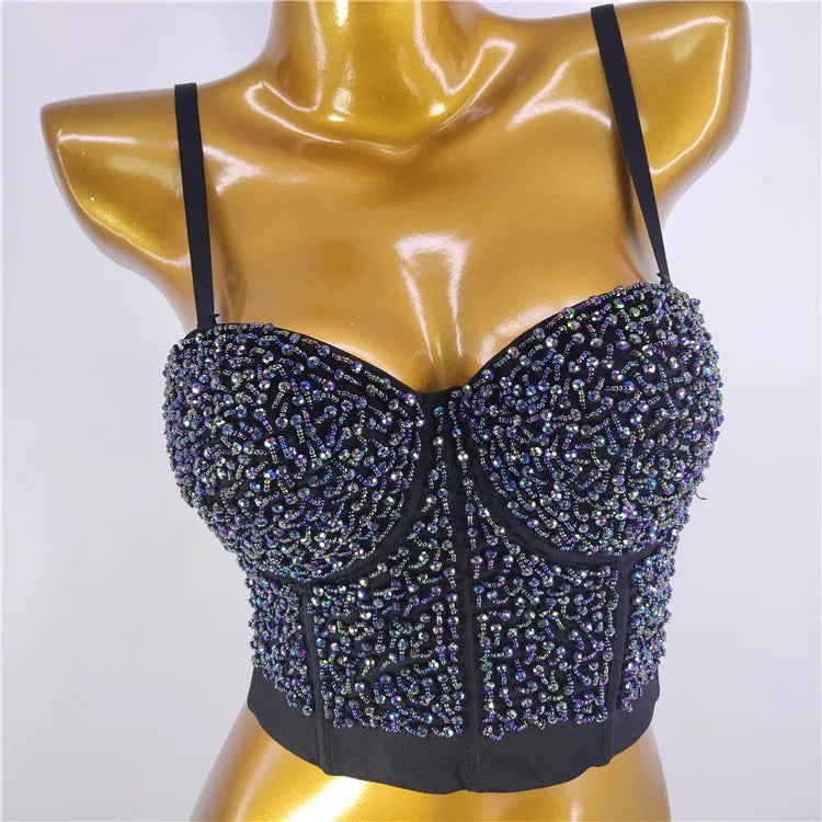 A women's stage performance outfit for the music festival with a halter top and glass beads wrapped around the chest, exposing t